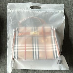 Brand new Loulu crossbody bag (H: 7”x L: 10” x W: 3.5”). Burberry color pattern